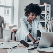 Businesswoman working on computer in shop